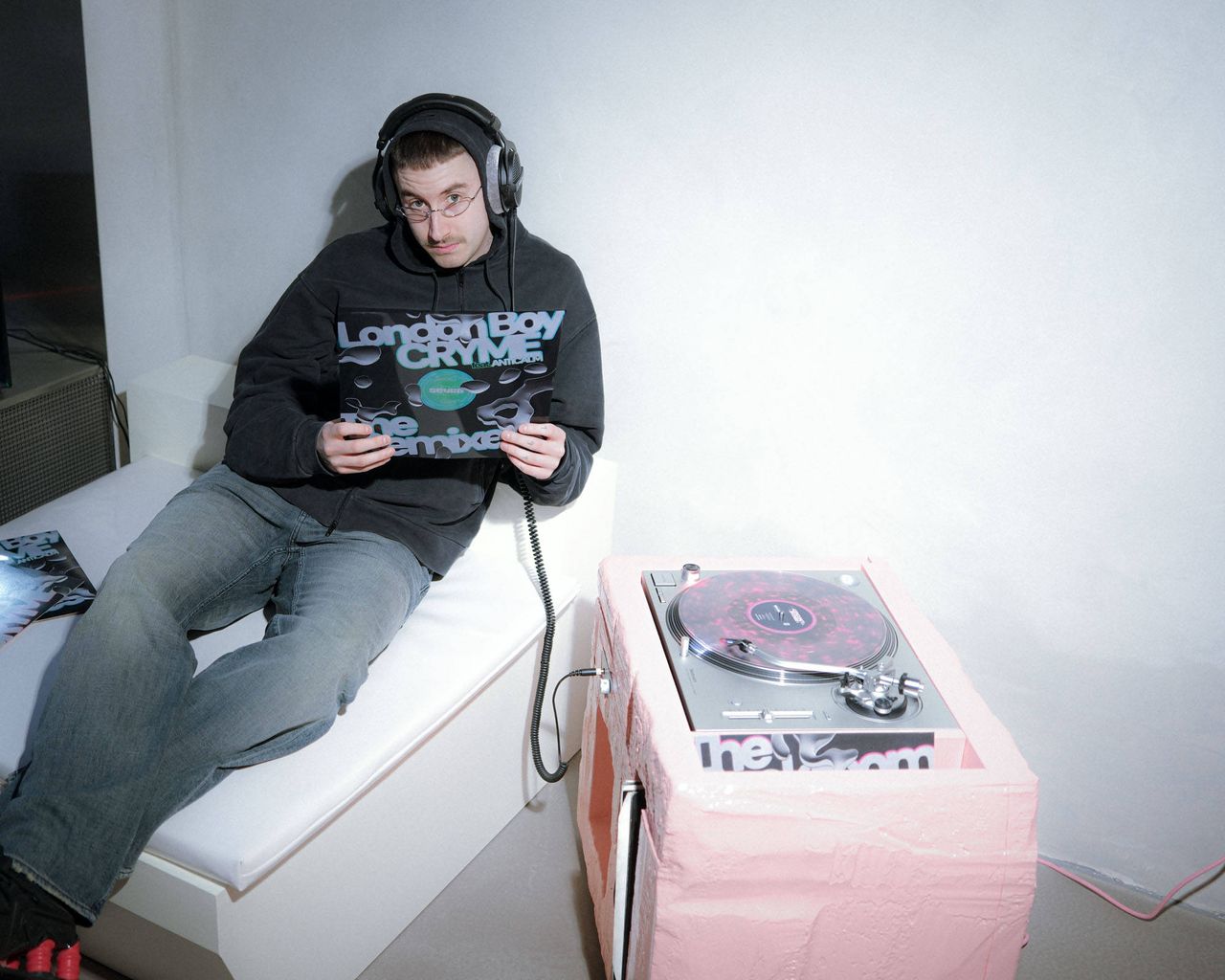 SEVEN7000LTD_CRYME is listening to the Backroom EP and holding the 7000LTD vinyl.jpg