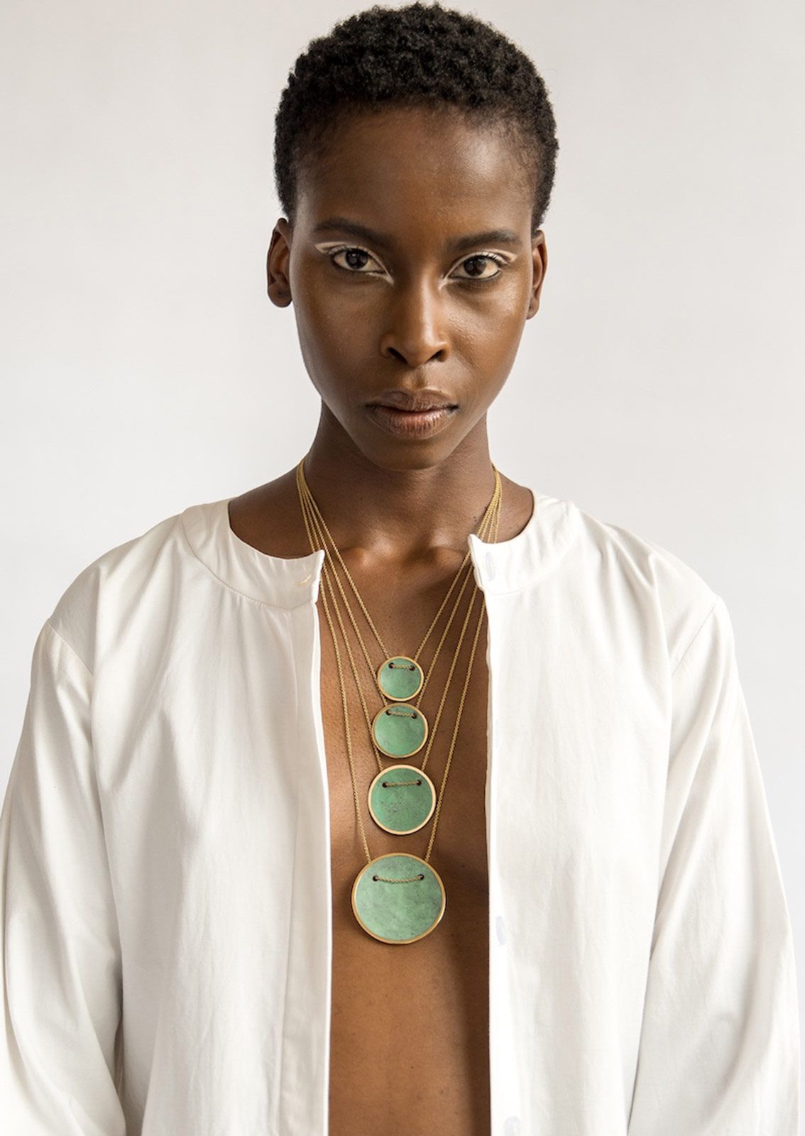 Ami Doshi Shah Vessel Pendants.jpg